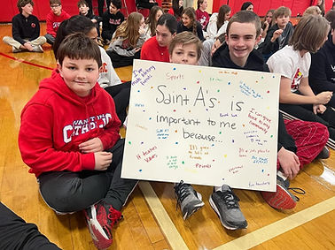 St. A's students holding up sign
