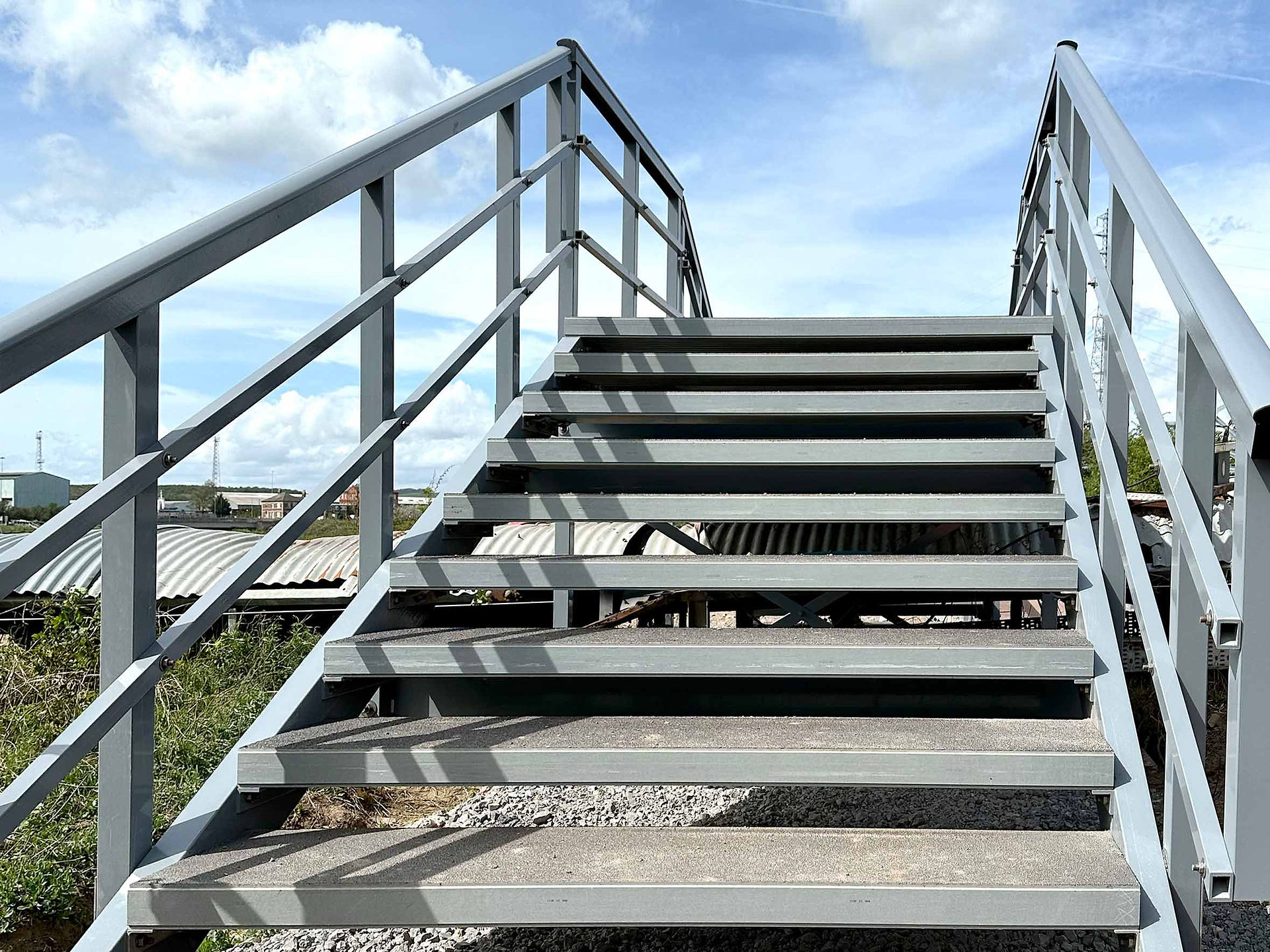 Grey steps leading to footbridge