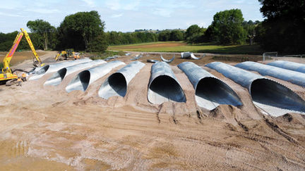 Steel culverts lined up in a row