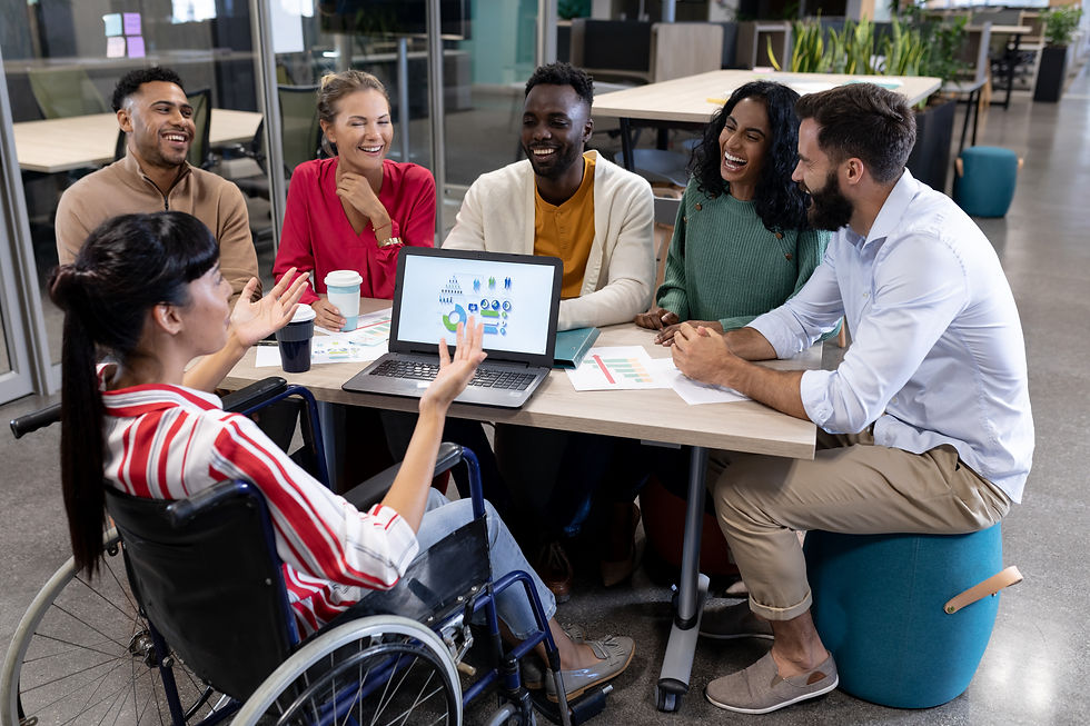Diverse team collaborating around a table with excitement.