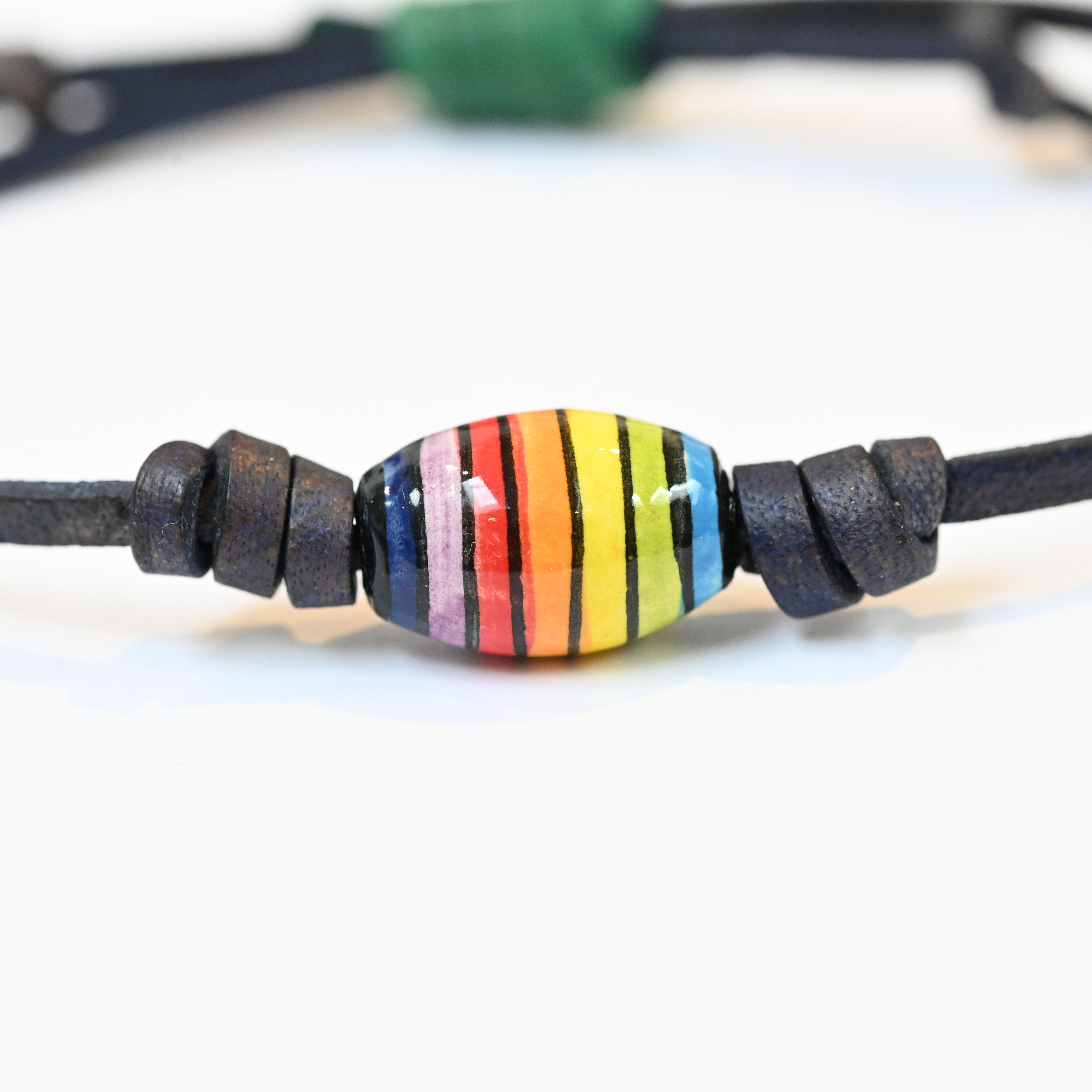 Rainbow Bead on Blue Leather