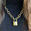Thumbnail: Vintage Louis Vuitton Luggage Lock Necklace on black sweater