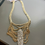 Thumbnail: Made in the Deep South Gold Multi Strand Necklace Rhinestone Brooch