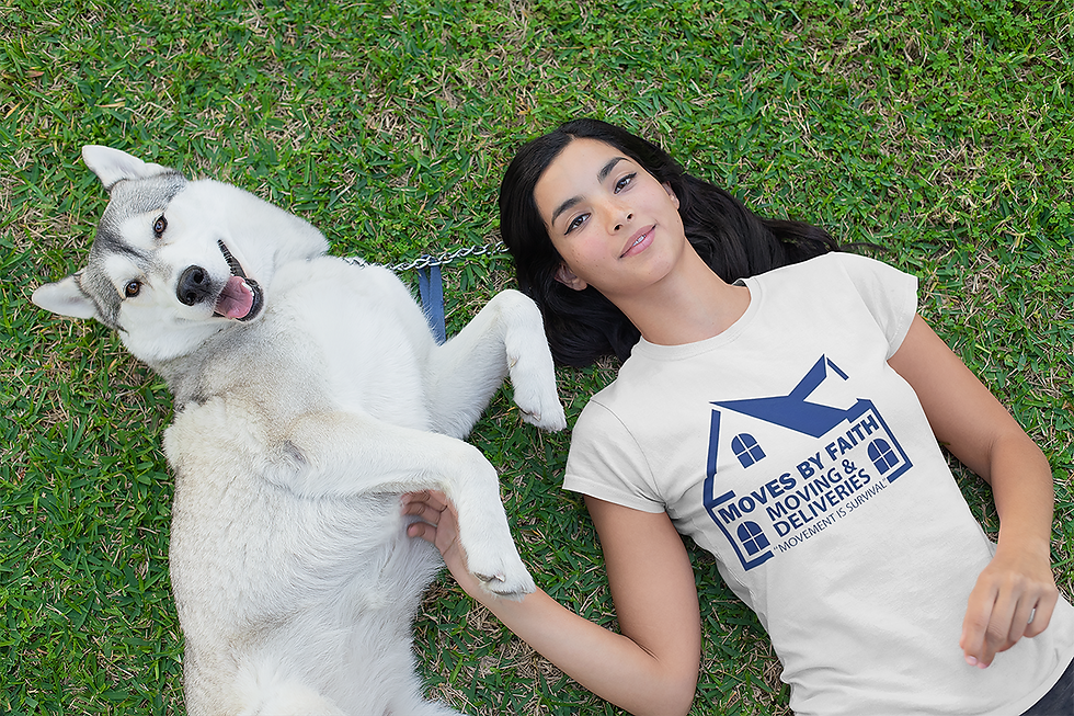 Close-up view of Moves By Faith Logo Tee folded neatly on a colorful blanket.