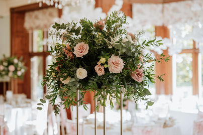 tall wedding table flowers on gold stands