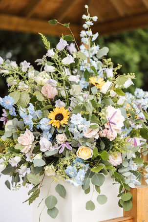 outdoor wedding ceremony flowers in pastel colours