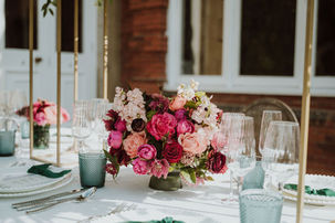 Luxury wedding table flowers in jewel tones