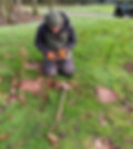 man setting a mole trap