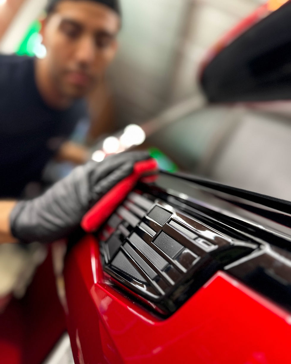 a Cadillac getting ceramic coated by the suds in midland tx