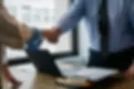 Clients collaborating with Capstone Security - a trusted private security contractor, making informed decisions through thorough security consulting and compliance risk assessment.