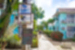 Placencia Sidewalk in Placencia Village Belize. Right next to the Ocean Breeze and Toucan Jacks Sign
