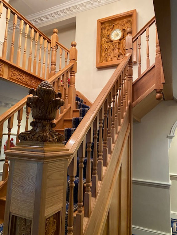 Inspired by Titanic's Grand Staircase, collector Alan Rowland adds some replicas by sculptor Alan St. George to his home's staircase.