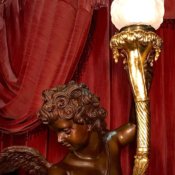 Detail of full-sized bronze Titanic cherub with 24 karat gold torch