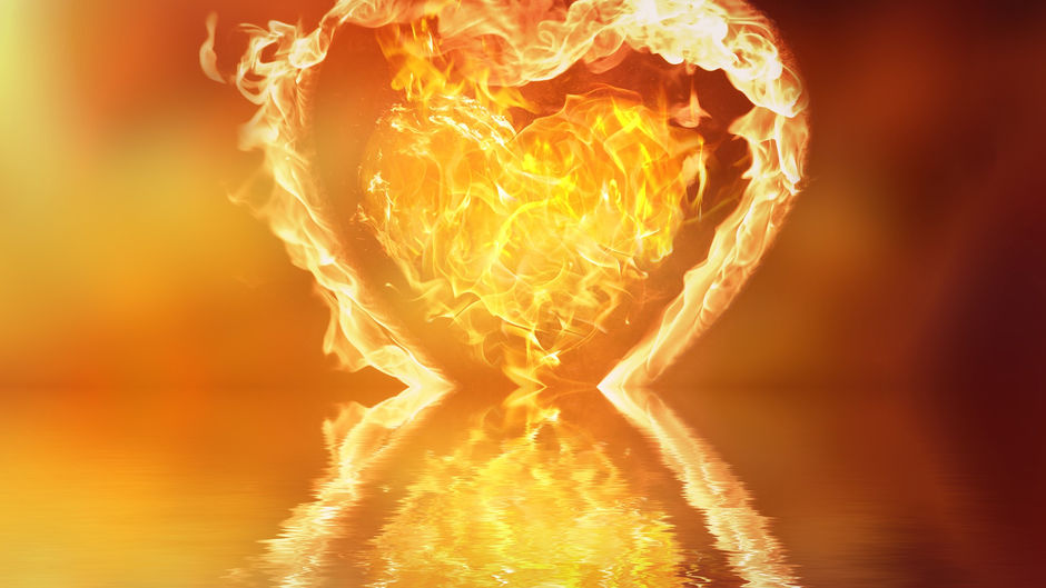 a heart on fire with flames