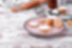 Shortbread cookies of round shape covered with sugar powder on the plate.jpg