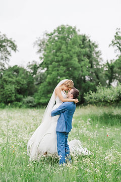 bride-groom-wildlfowers-hugging.jpeg