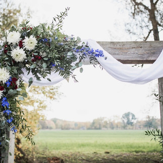 Flowers-barn-beam-arch-blue-heron-barn