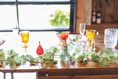 A wedding table set with colorful vintage goblets.