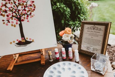 A tree with wedding guests paint thumbprints.