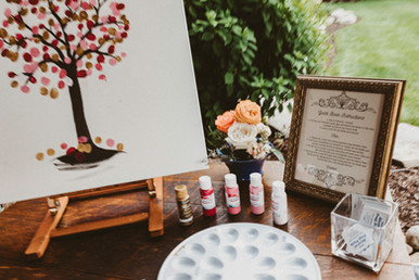 A tree with wedding guests paint thumbprints.
