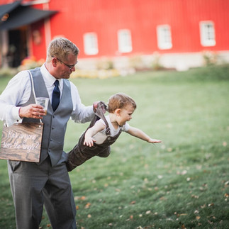 Boy-father-flying-blue-heron-barn