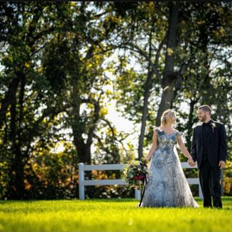 bride-groom-white-fence.jpeg