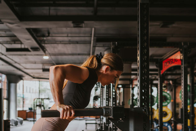 Athlete performing dips during a training session at TAC