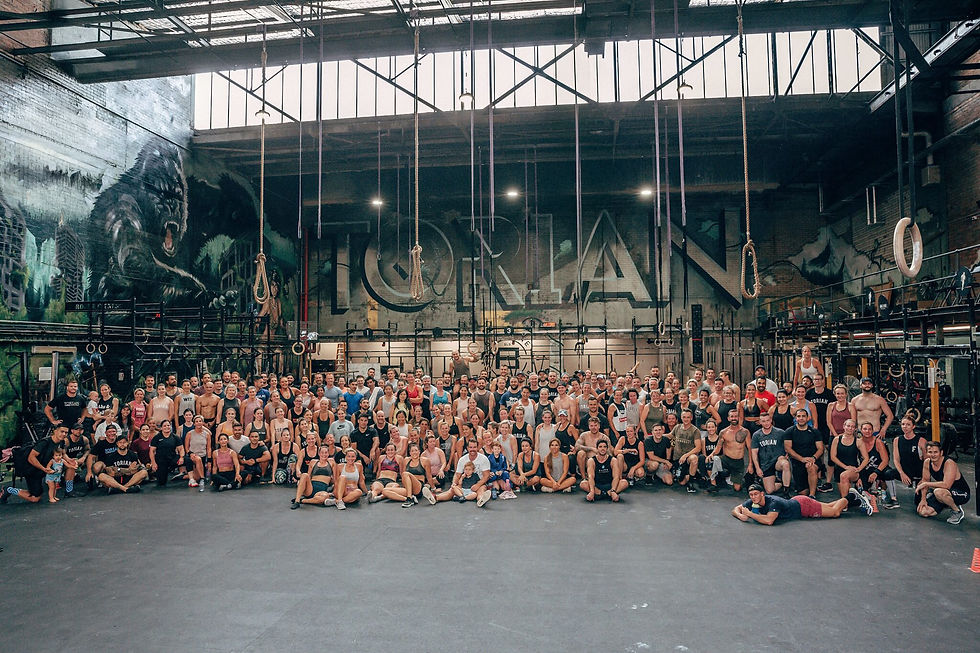 Group photo of CrossFit Torian community at the gym