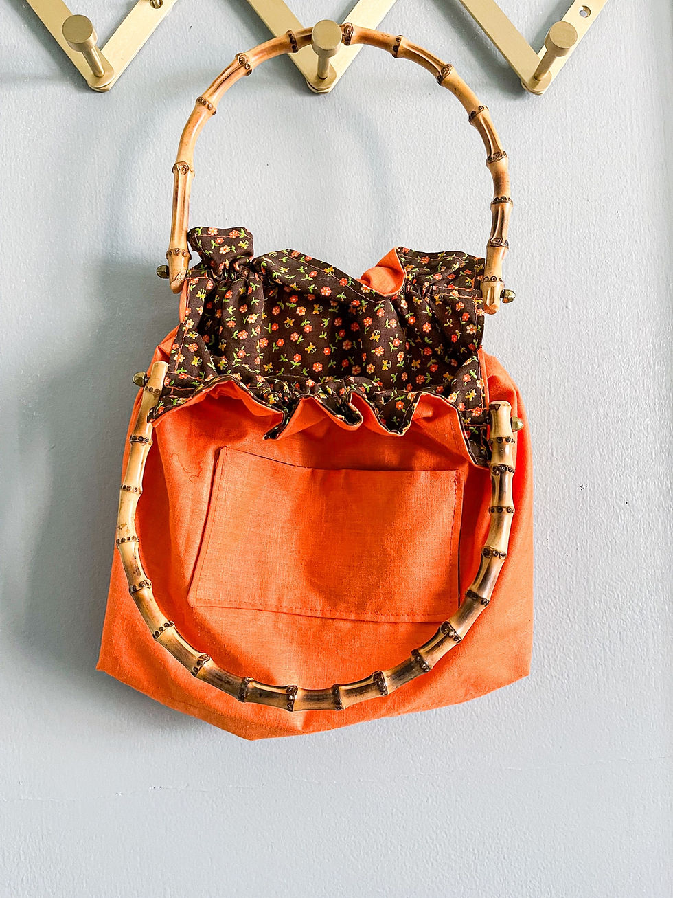 Thumbnail: Retro orange and floral handbag with bamboo handles 
