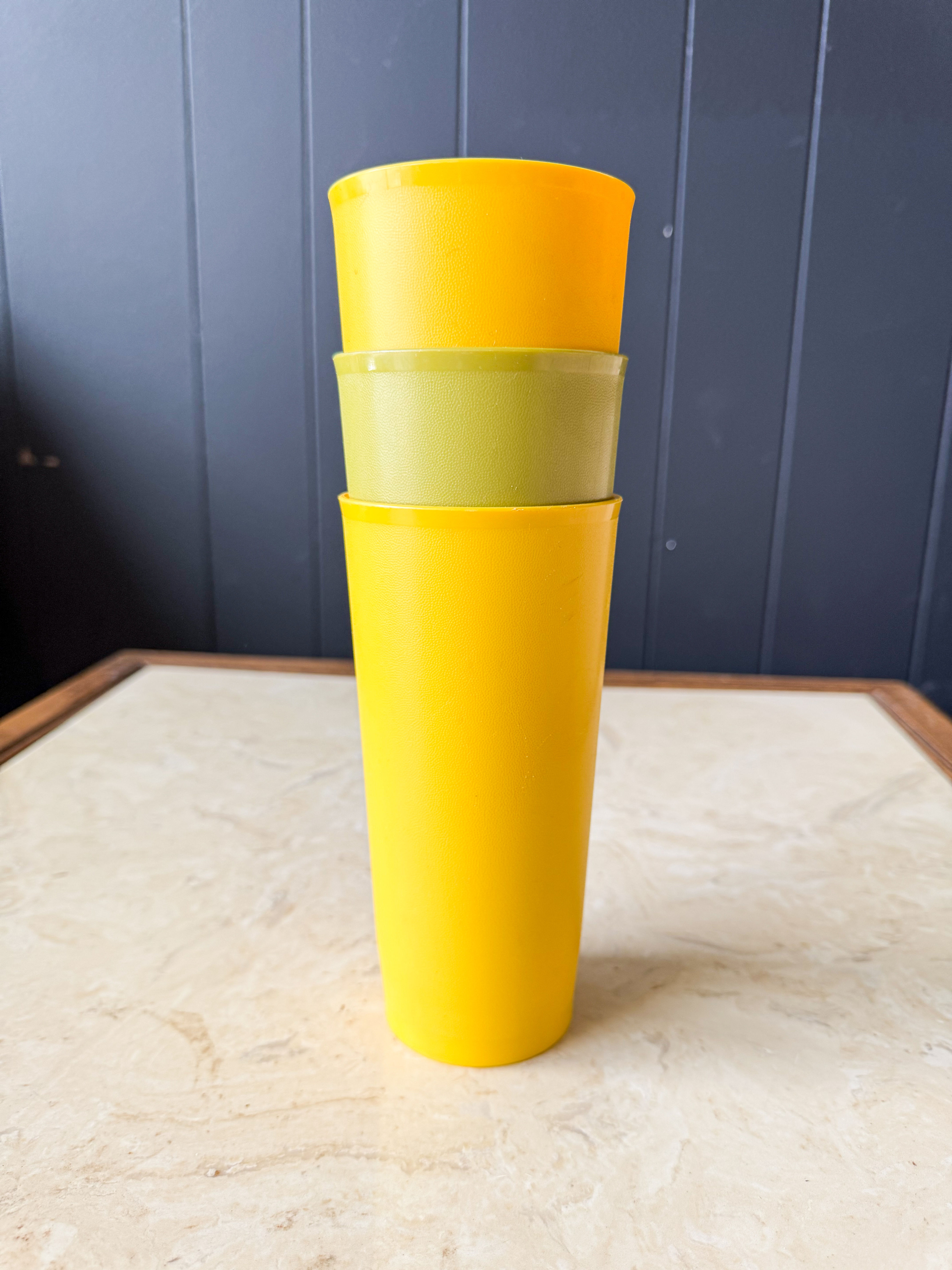 Set of three vintage Tupperware tumblers in assorted colors