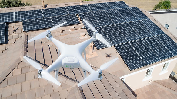 Drone flying over solar panels