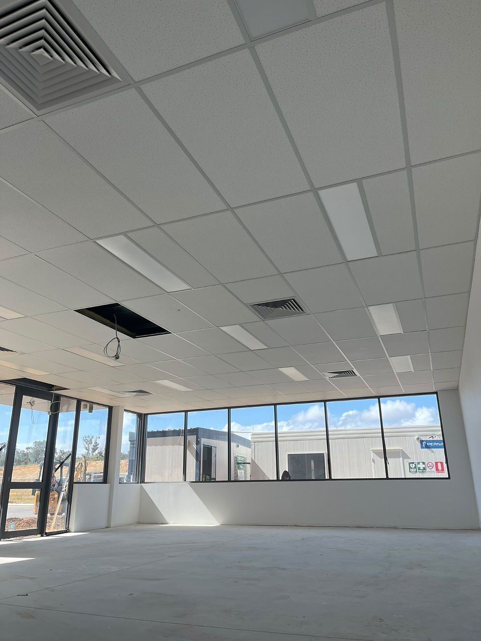 Suspended acoustic ceiling installation in a commercial interior