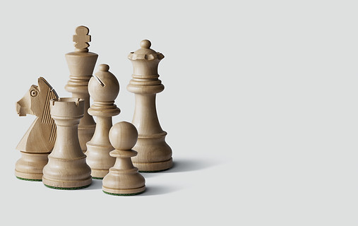 Assorted wooden White chess pieces and blank copy space.jpg