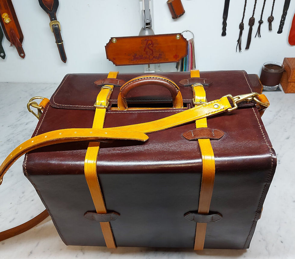 Bespoke, handcrafted leather toolbox with removable shoulder strap