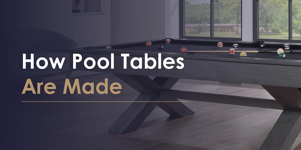 Pool table with balls and cue on a wooden floor near large windows. Text: How Pool Tables Are Made. Bright, spacious setting.