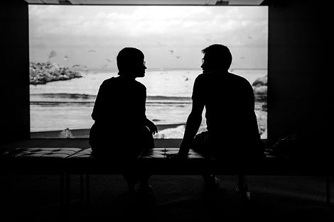 silhouette of man and woman sitting on ottoman_edited.jpg