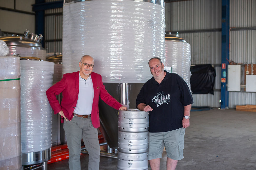 The Sheds at Brendale Hip Hops Brewers Shaun infront of keg