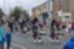 Front of procession - pipe band and standards.jpg