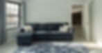 Remodeled room with gray couch and blue throw rug Dunbarton, NH