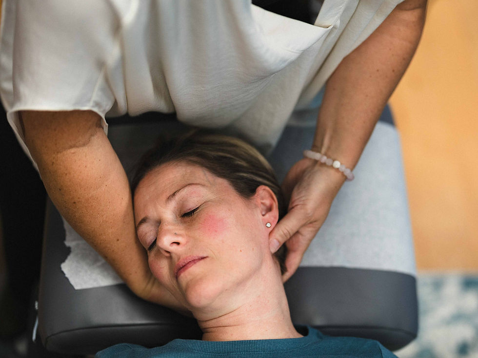 Eye-level view of a chiropractor adjusting a patient's neck in a calm treatment room