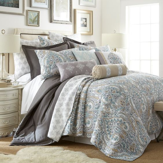 An image showcasing design ideas to achieve the perfect blend of classic and modern aesthetics in a bedroom setting. The image likely highlights a variety of bedroom styles emphasizing neutral transitional design. Expect to see soft, muted color palettes featuring beige, gray, and cream tones that create a serene and calming atmosphere. Furniture pieces may include a combination of traditional and contemporary styles, such as a sleek platform bed paired with a tufted headboard, or an elegant armchair with clean lines. Accents such as layered textiles, throw pillows, and area rugs in subtle patterns enhance the cozy vibe. Lighting options may range from chic pendant lights to vintage-inspired table lamps, casting a warm, inviting glow. Decorative elements like abstract artwork, simple greenery, or textured wall panels further elevate the modern-classic harmony. The overarching theme is a tranquil, stylish bedroom that exudes relaxation and timeless beauty, ideal for anyone seeking inspiration for a balanced, peaceful retreat.