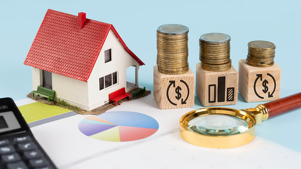 Model house with a red roof, coins on wooden blocks with symbols, magnifying glass, and graph on a blue background, suggesting finances.