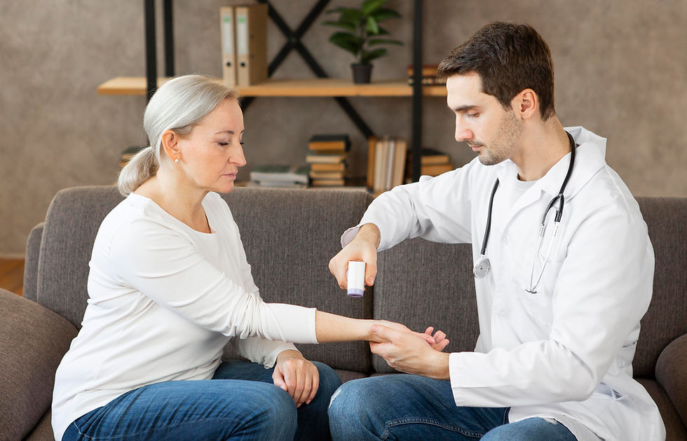 A doctor applies ointment to a woman's arm on a couch in a cozy room with books and plants, both focused and calm.