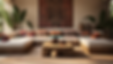 Cozy living room with a U-shaped sofa, colorful cushions, and a wooden coffee table. A tribal tapestry hangs on the wall; plants flanking.