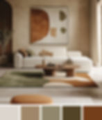 Modern living room with a white sofa, abstract painting, brown and green rug, wood table, and potted plant. Neutral, cozy ambiance.