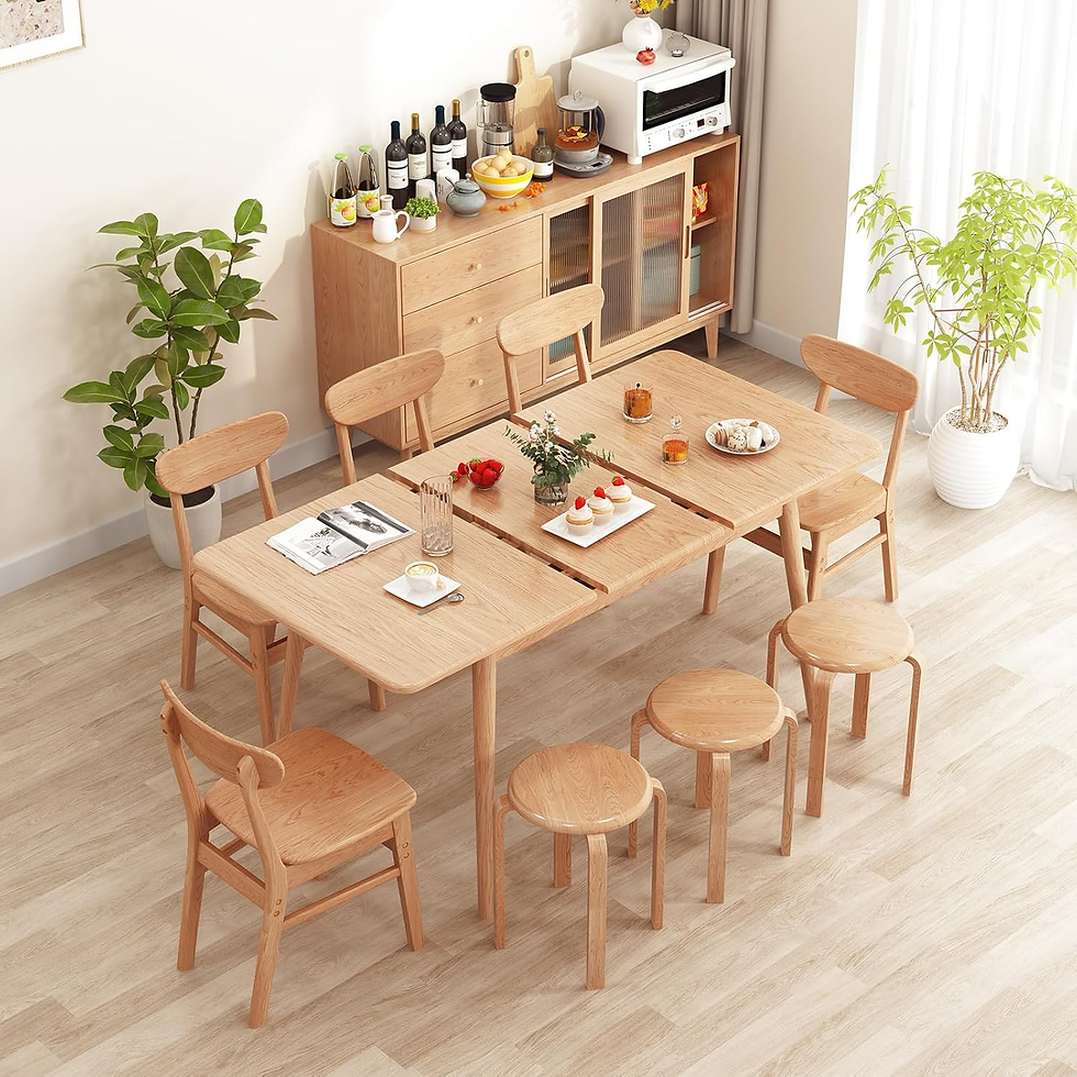 Farmhouse kitchen with a wooden dining table, matching chairs, open shelves, and bright natural light from large windows. The rustic wood tones create a cozy, inviting dining space