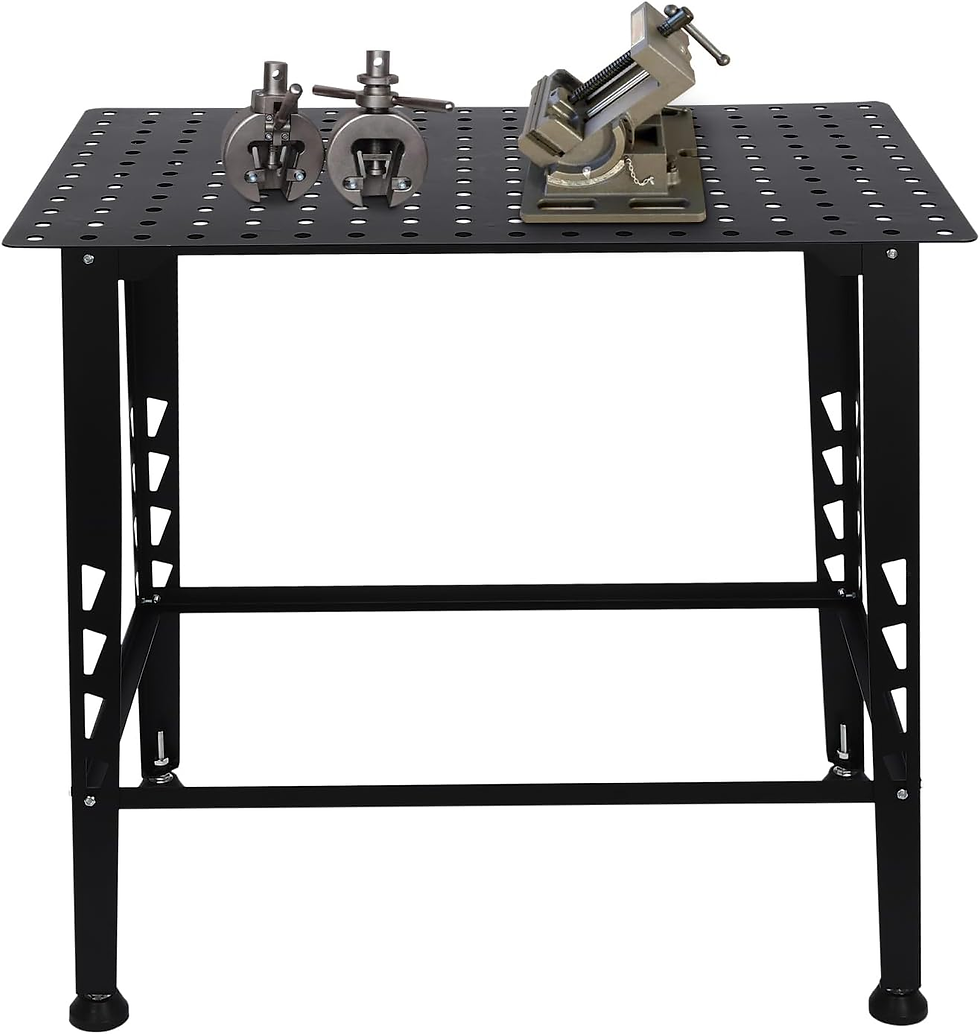Black metal workbench with perforated top holds a gray vise and clamps. Simple, industrial setting with no visible text or background.