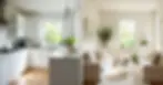 A side-by-side comparison of a kitchen painted in bright white and a living room painted in soft off-white, showing differences in light reflectivity.