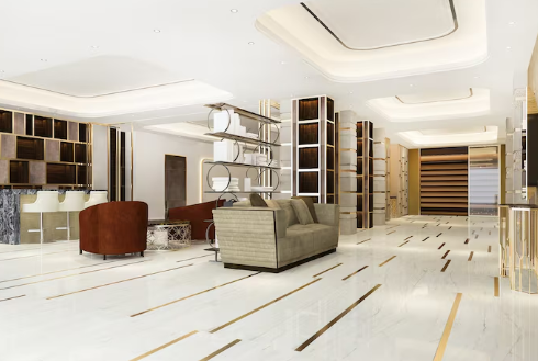 Luxurious, spacious lobby with modern sofas, geometric shelves, marble floor, and wood accents. Bright lighting creates an elegant ambiance.