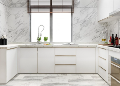 Modern kitchen with white cabinets, marble countertops, plants, and utensils. Bright window with blinds, sleek and clean atmosphere.
